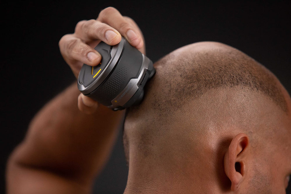 MicroTouch Titanium Head Shaver blade close-up shows titanium-coated sharp edges.