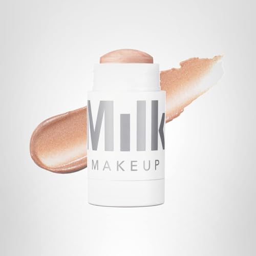 Milk Makeup Lit highlighter stick for face and body glow.