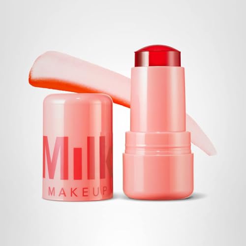 Milk Makeup Spritz Coral shade on lips adds bright color.