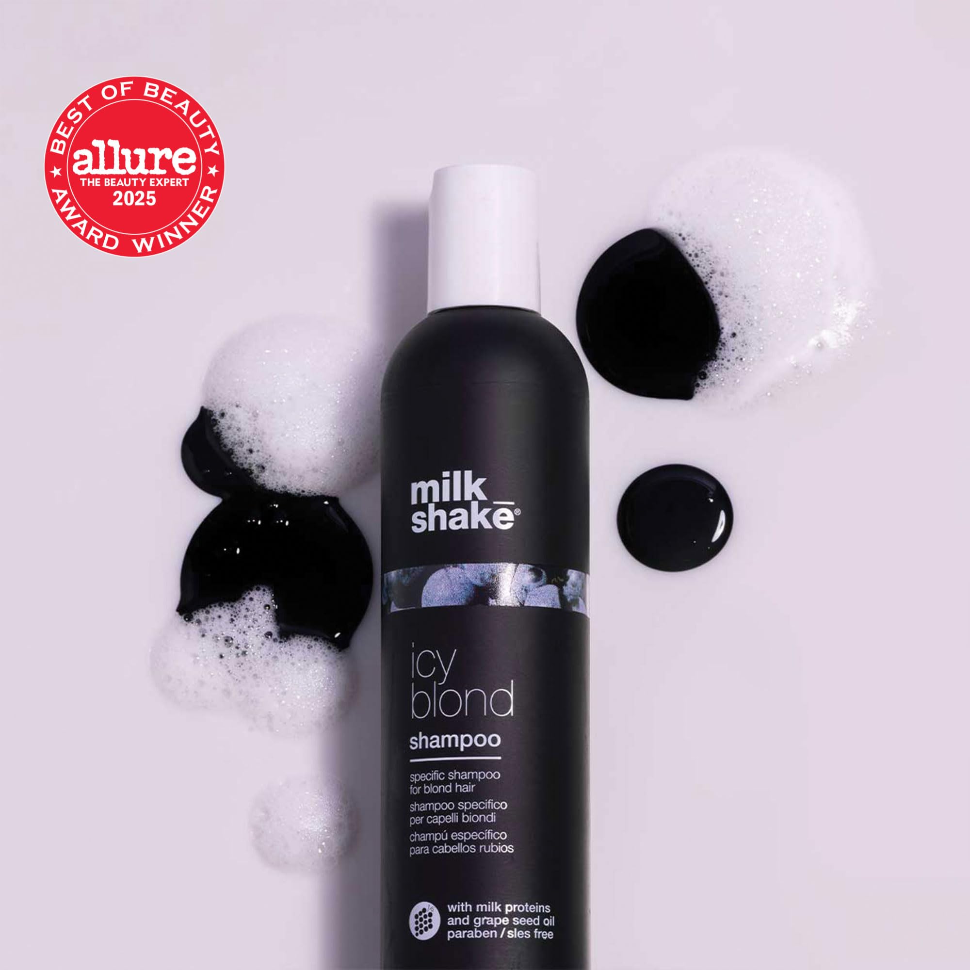 Pouring Milk-Shake icy blond shampoo to begin a cool-toned wash.