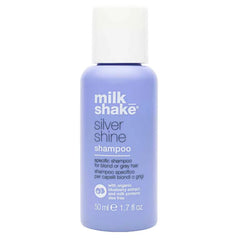 milk_shake Silver Shine: botella morada con bomba para rubio vibrante y saludable.