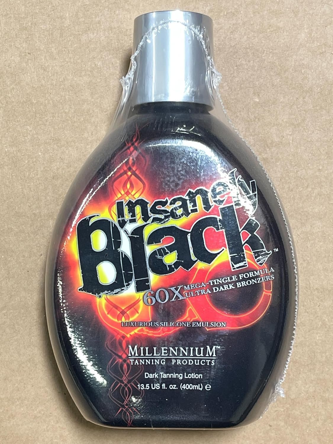 Millennium Tanning Insanely Black 60x finished tan look on the arm and leg.