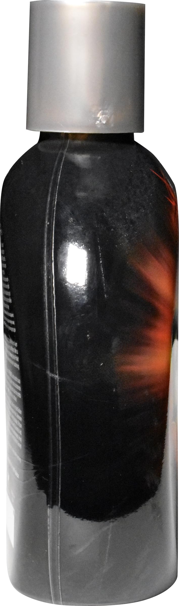 Millennium Tanning Insanely Black 60x texture detail shows rich lotion consistency.