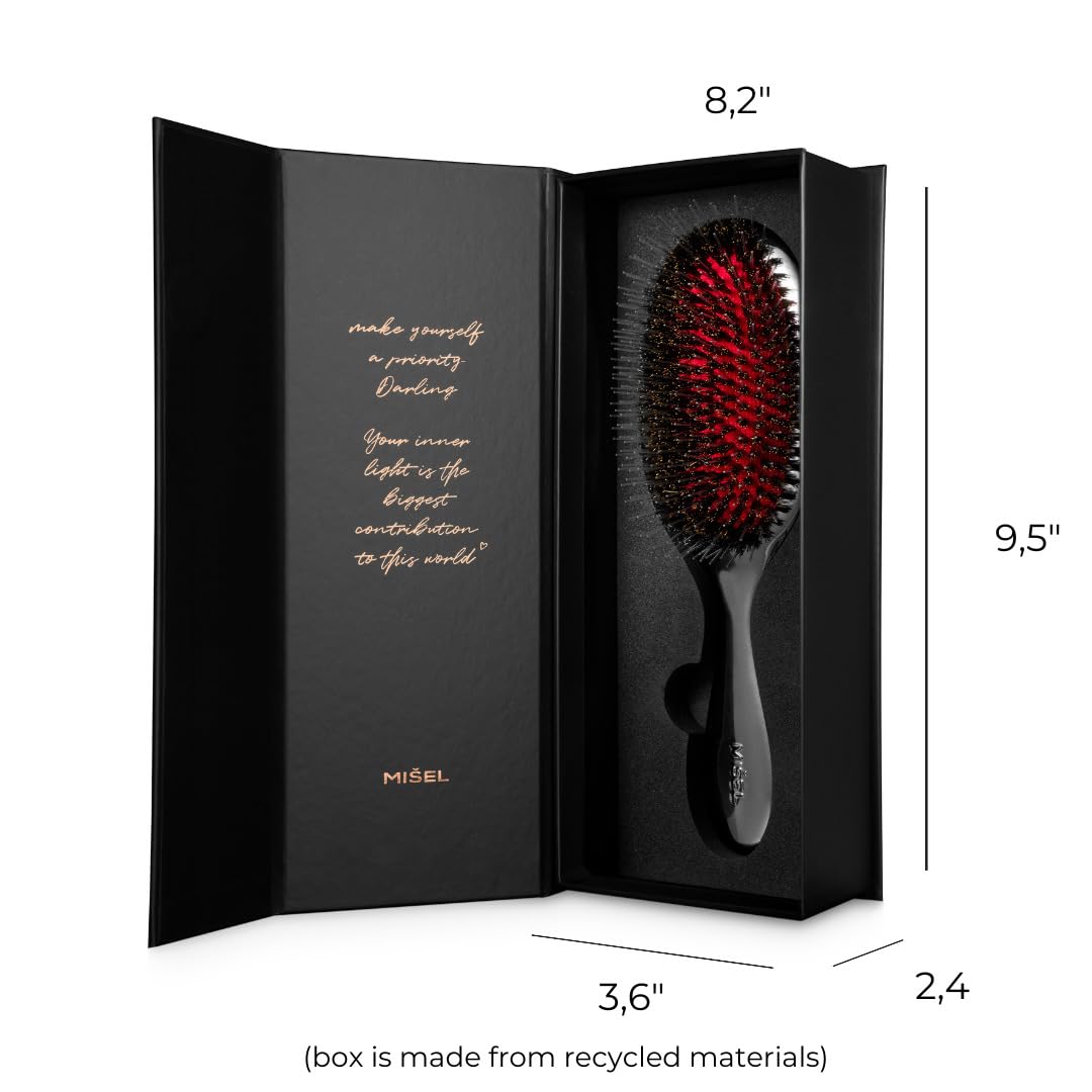 Misel brush gliding through hair for smooth styling.