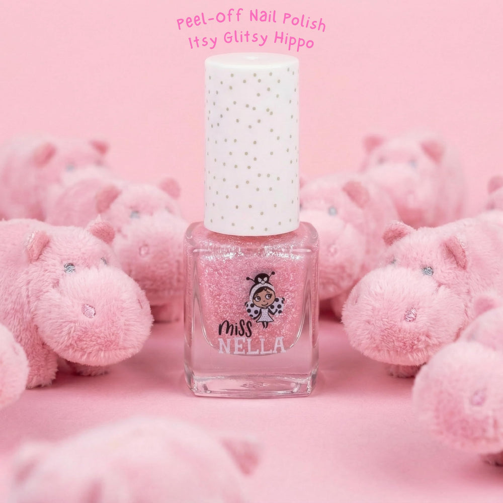 MISS NELLA Itsy Glitsy Hippo being applied on a child's nail with sparkle