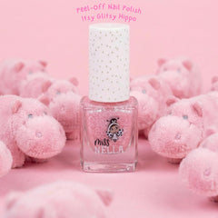 MISS NELLA Itsy Glitsy Hippo being applied on a child's nail with sparkle