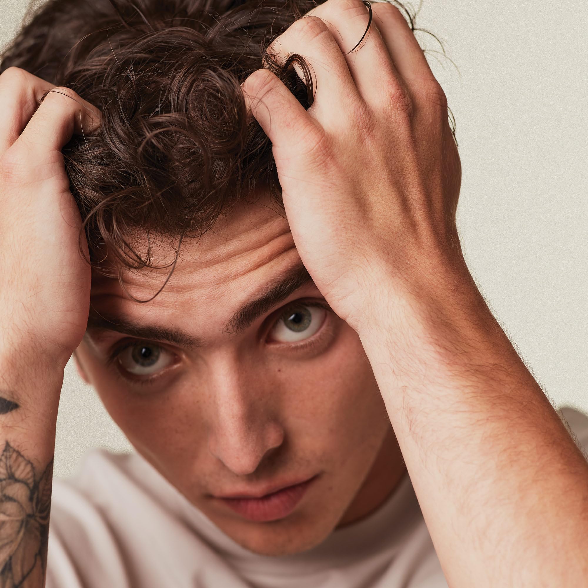 MITCH jar and bottle display high hold formula for all hair types.