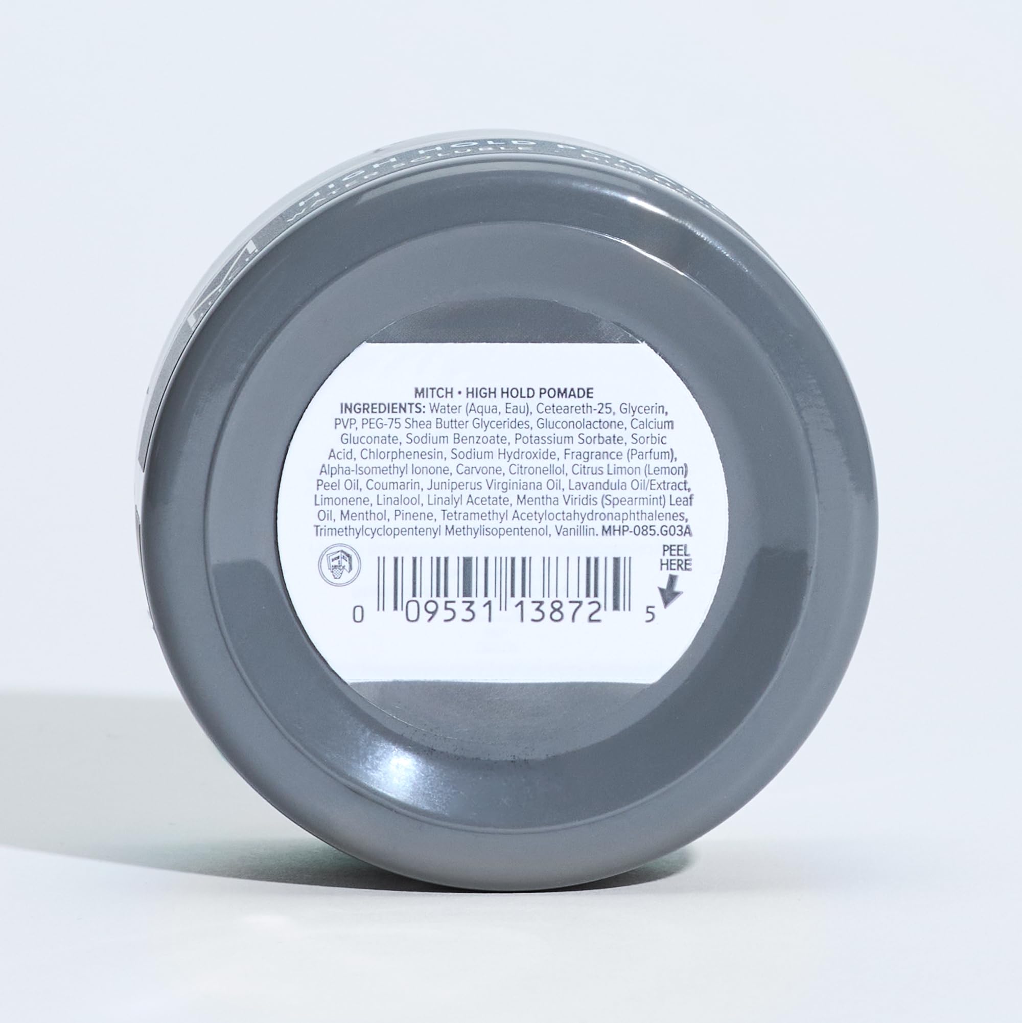 MITCH High Hold Pomade bottle close-up with energizing agave citrus fragrance theme.