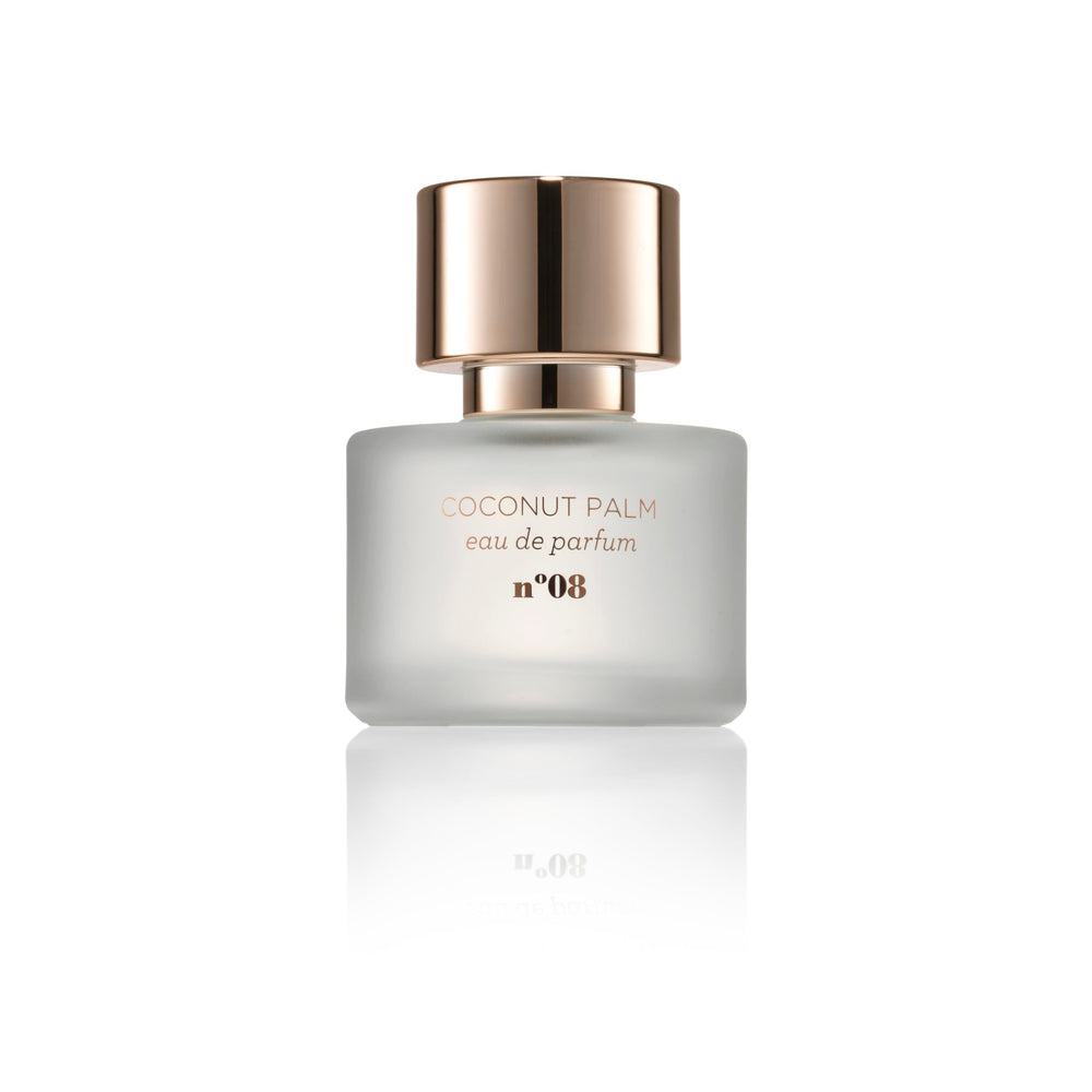 MIX:BAR Coconut Palm spray action, suggesting a luxe, long-lasting fragrance experience.