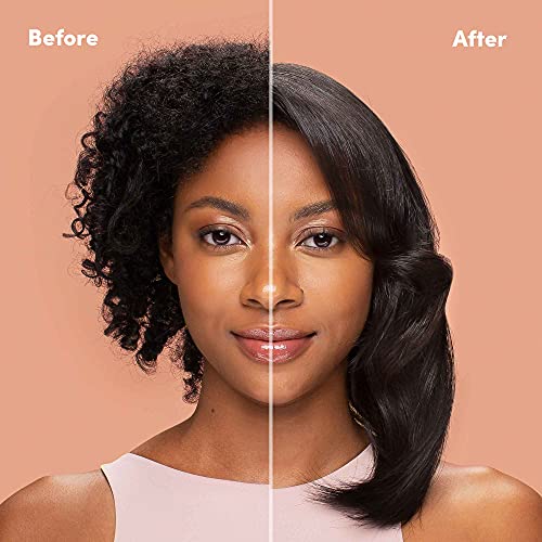 Blow-drying with Mizani Raincoat for a refined, polished finish.