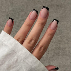 Modelones Black French Tip press-on nails in a short square shape for a quick, stylish manicure.