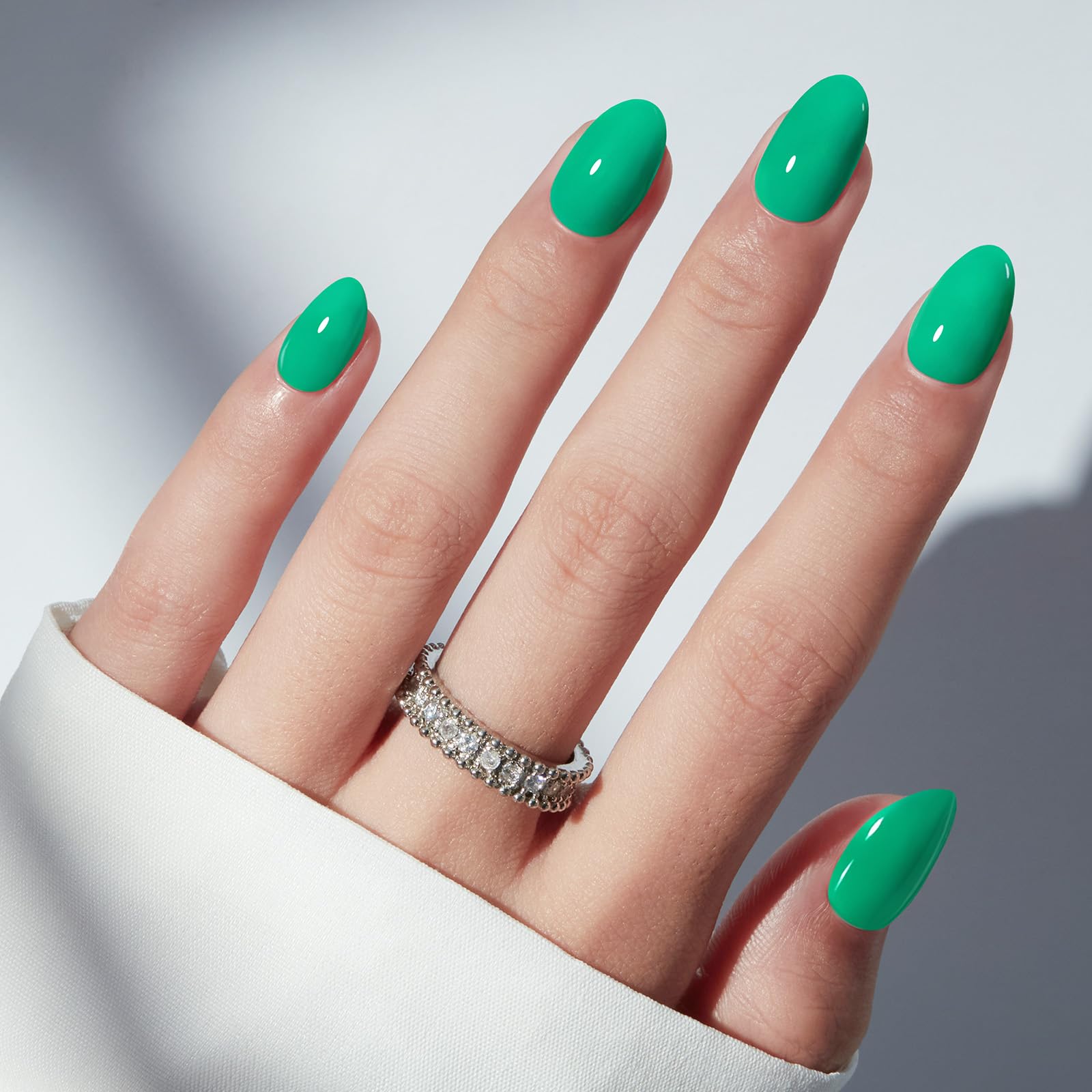 Modelones Bright Green nails on hand showing natural fit and style