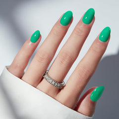 Modelones Bright Green nails on hand showing natural fit and style