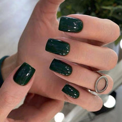 Modelones Dark Green press-on nails in close-up with a vibrant, smooth finish for quick wear.
