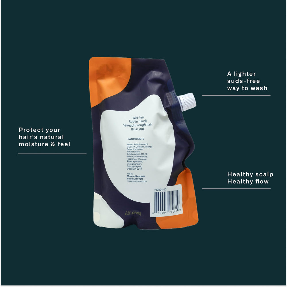 32oz packaging displayed on shelf beside grooming products