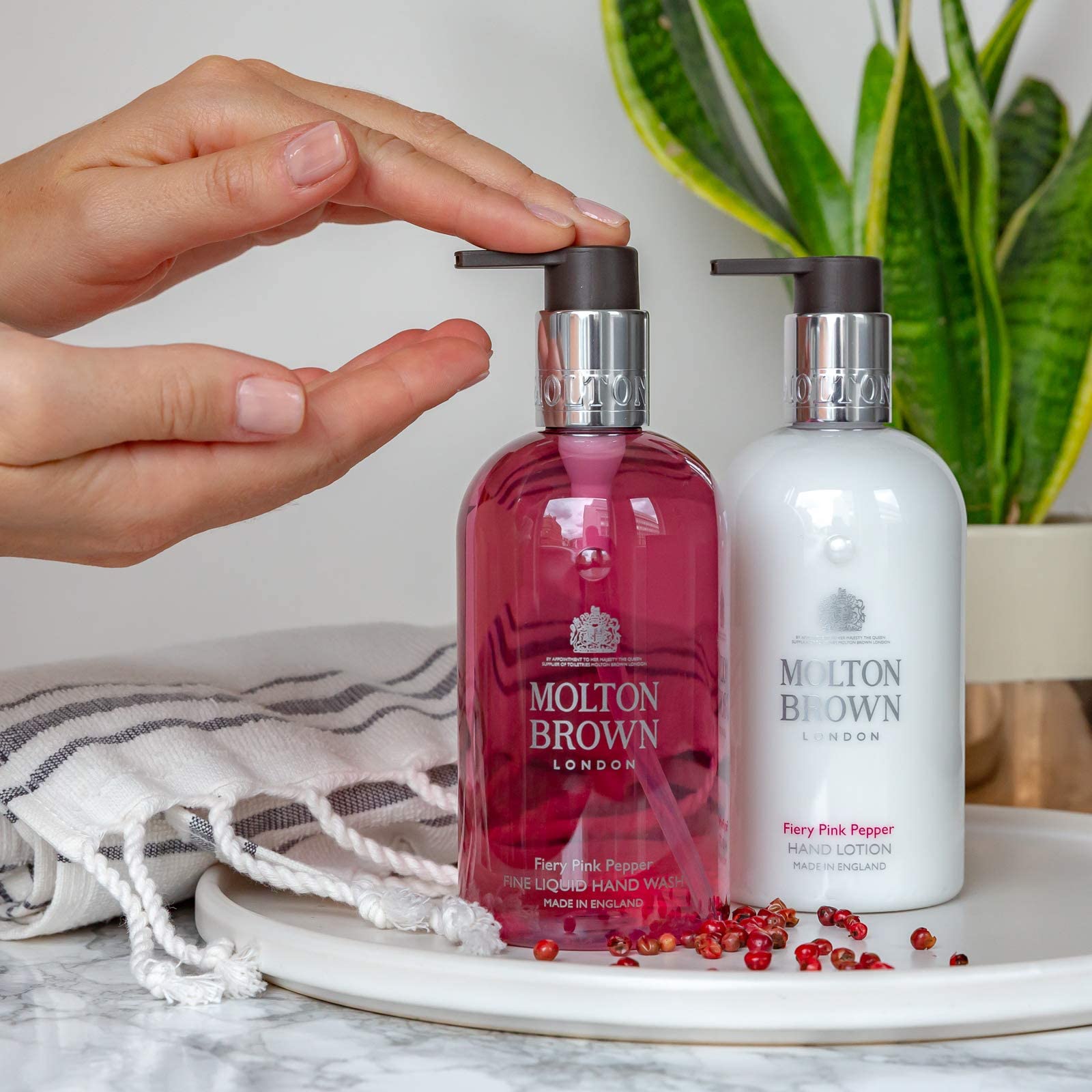 Molton Brown Fiery Pink Pepper shelf display suggests premium hand care
