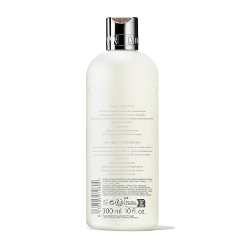 Molton Brown conditioner being applied to hair for smooth, manageable results