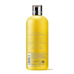 Molton Brown Purifying Shampoo lather close-up highlighting floral notes and daily luxury
