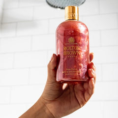 Close-up of Rose Dunes foamy lather highlighting creamy texture and fragrance.