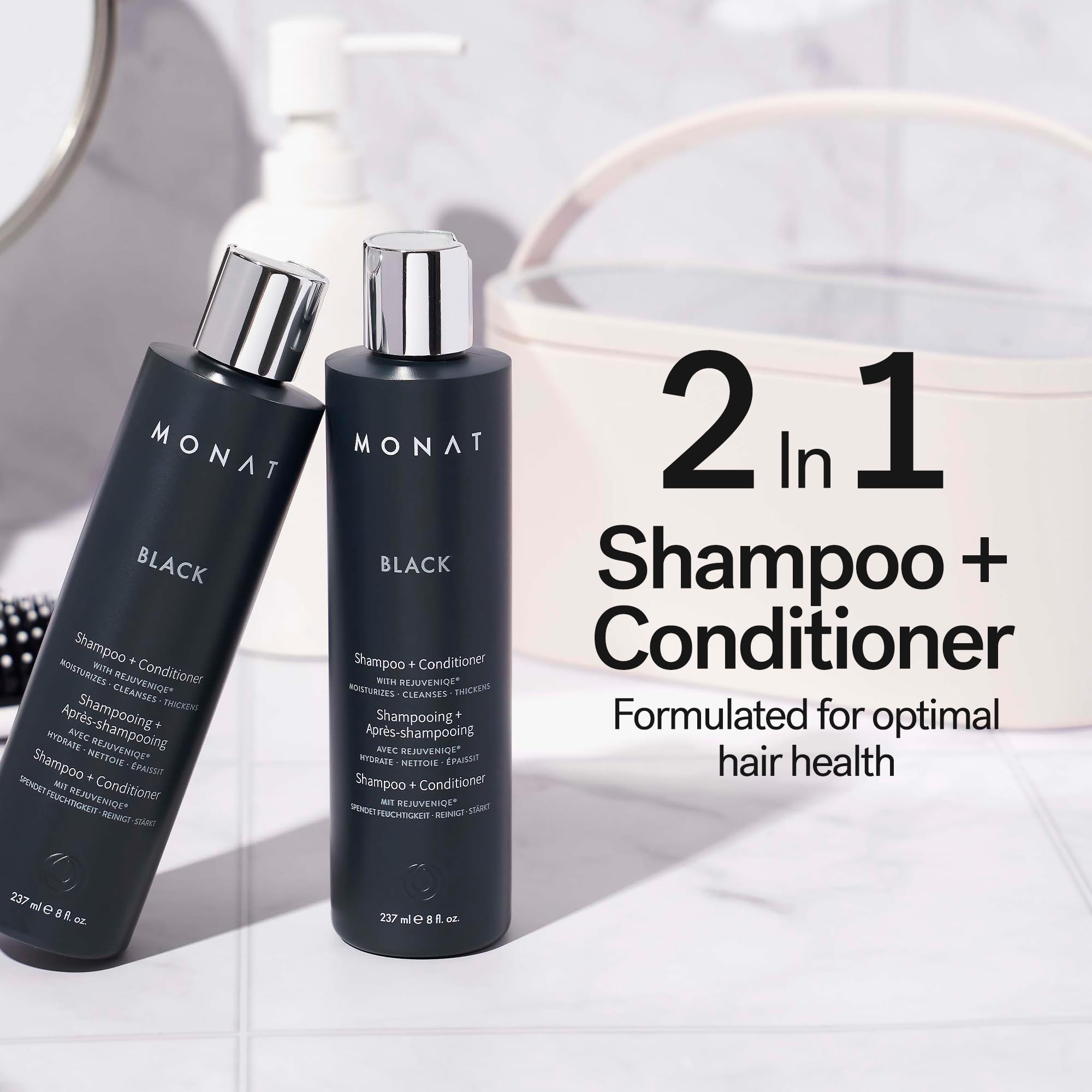 MONAT Black Shampoo + Conditioner bottle closeup highlights the dual-action formula.