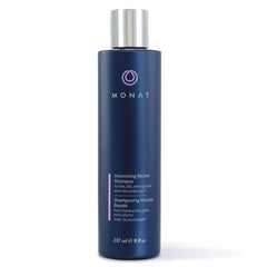 MONAT Volumizing Revive Shampoo bottle close-up showing weightless volume for fine hair.