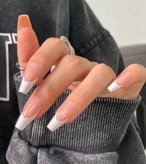 Morily light pink white French tip nails with a ready-to-wear glossy manicure.