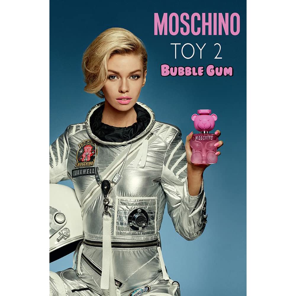 Moschino Bubble Gum spray nozzle in action, suggesting easy application and even scent distribution.