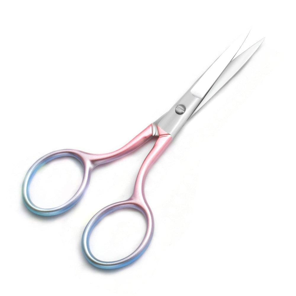 Motanar grooming scissors held in hand illustrating portable at-home use.