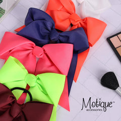 Motique White Jumbo Bow Pony with Tails, side view, secure elastic tie supports lasting wear.