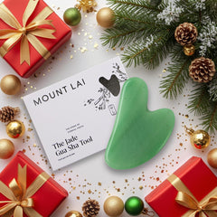 Mount Lai Jade Gua Sha on cheeks provides gentle lift with outward massage.