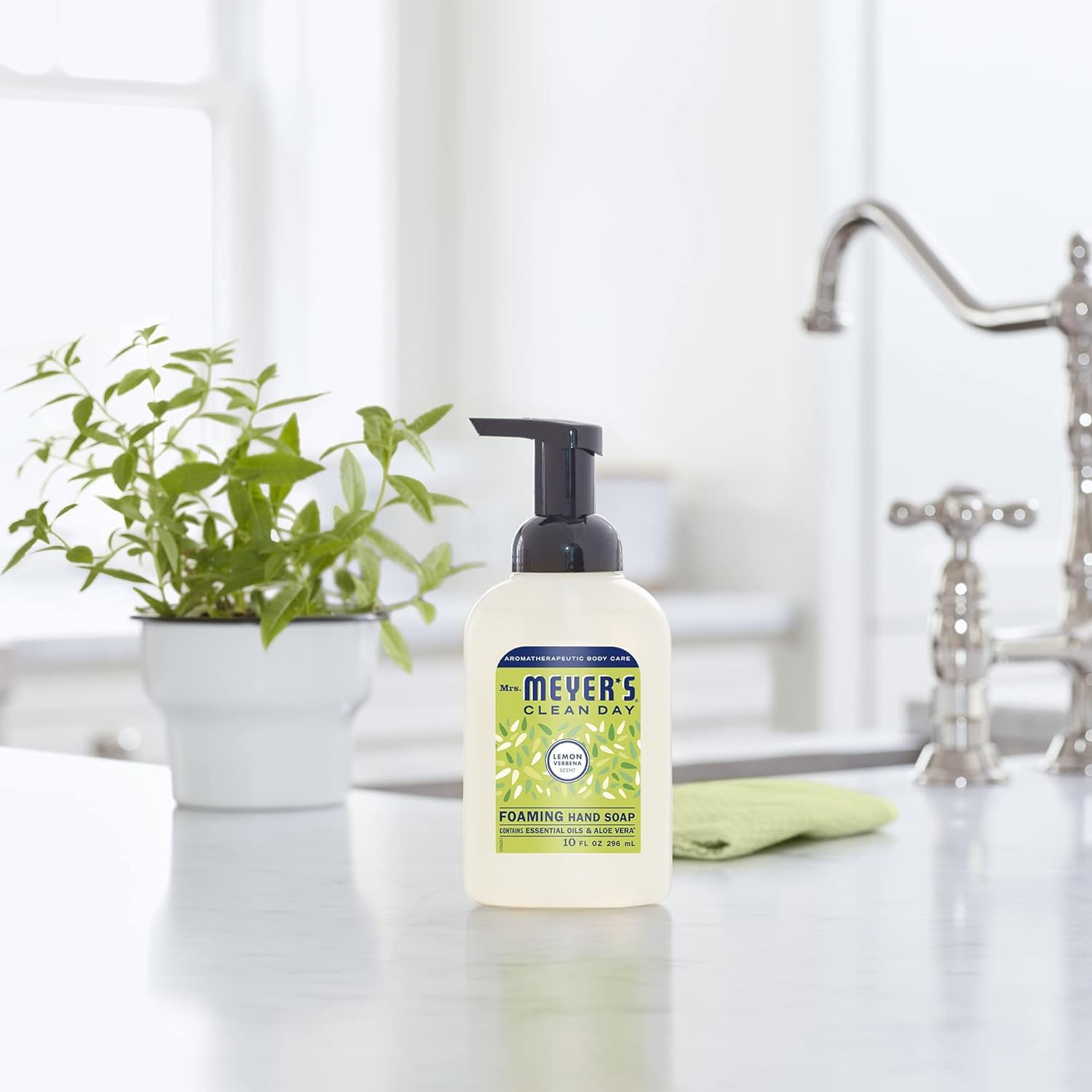 Hand washing scene in kitchen with fresh, garden-inspired scent