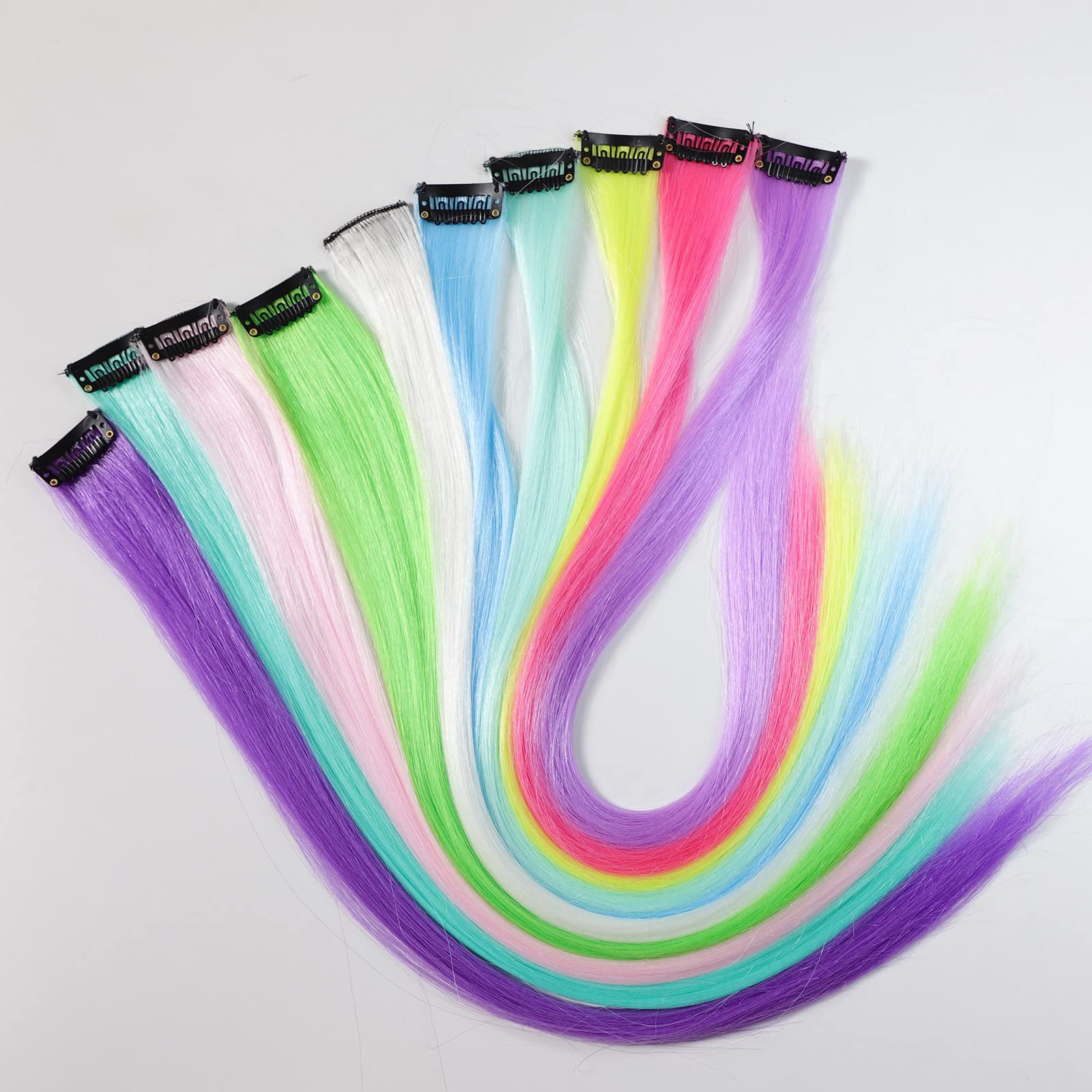 Ms Aloe glow-in-the-dark clip-in extensions shown on head for bold rainbow look