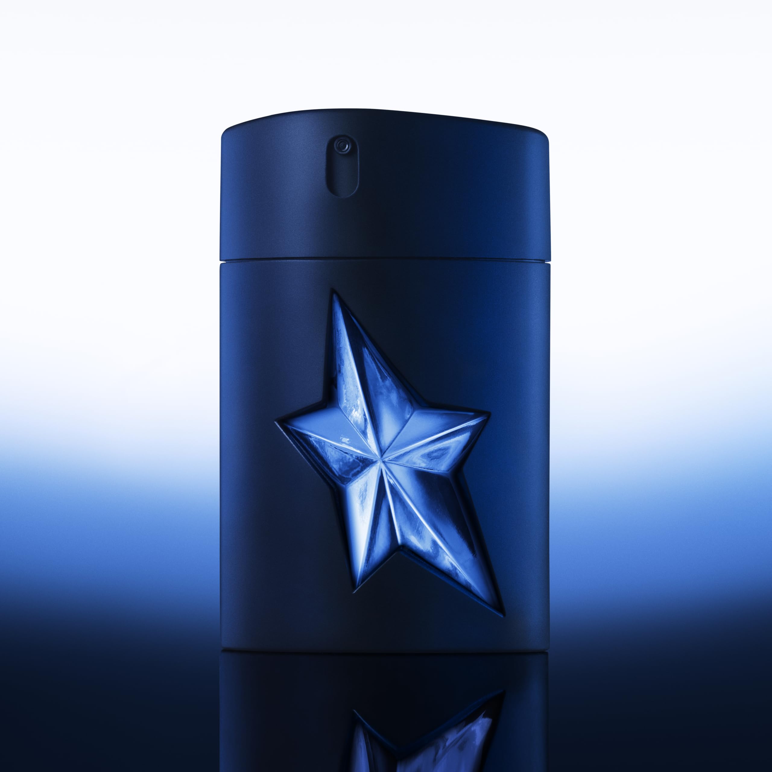 Mugler A*Men bottle etched label conveying rugged masculine character.
