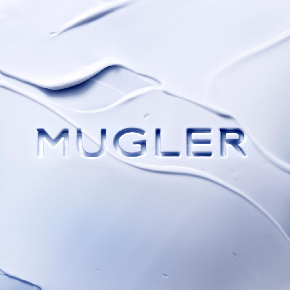 Mugler Angel Body Lotion cream application close-up highlighting instant comfort.