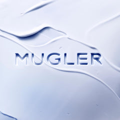 Mugler Angel Body Lotion cream application close-up highlighting instant comfort.