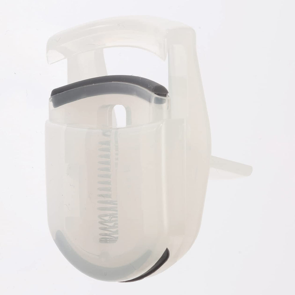 MUJI portable eyelash curler shown with compact packaging.