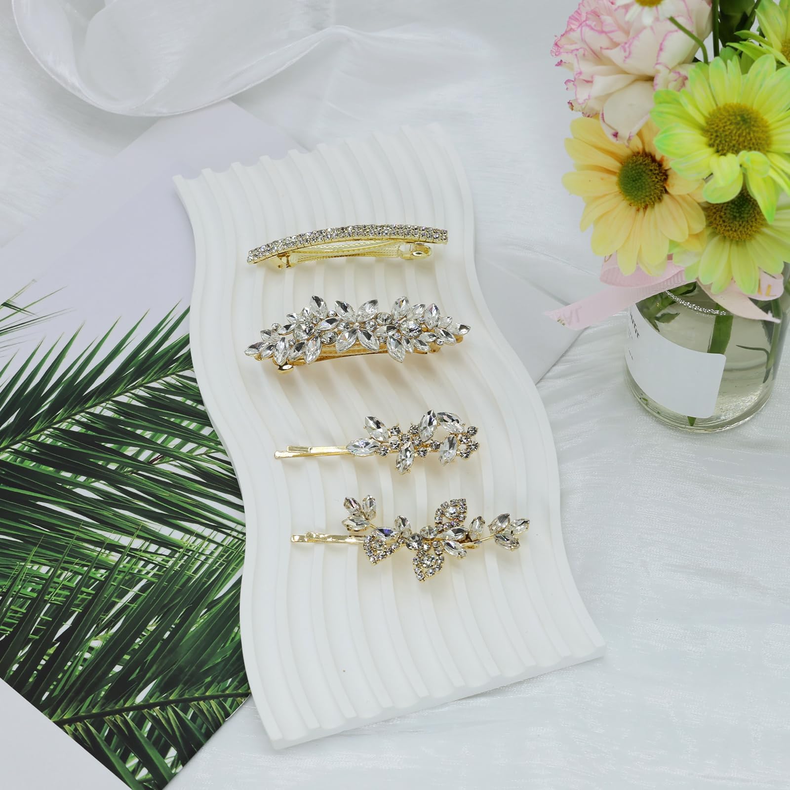 Mulzile wedding hair accessory display highlights four-piece set in gold.