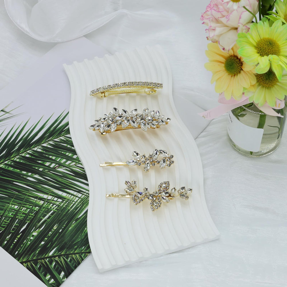 Mulzile wedding hair accessory display highlights four-piece set in gold.