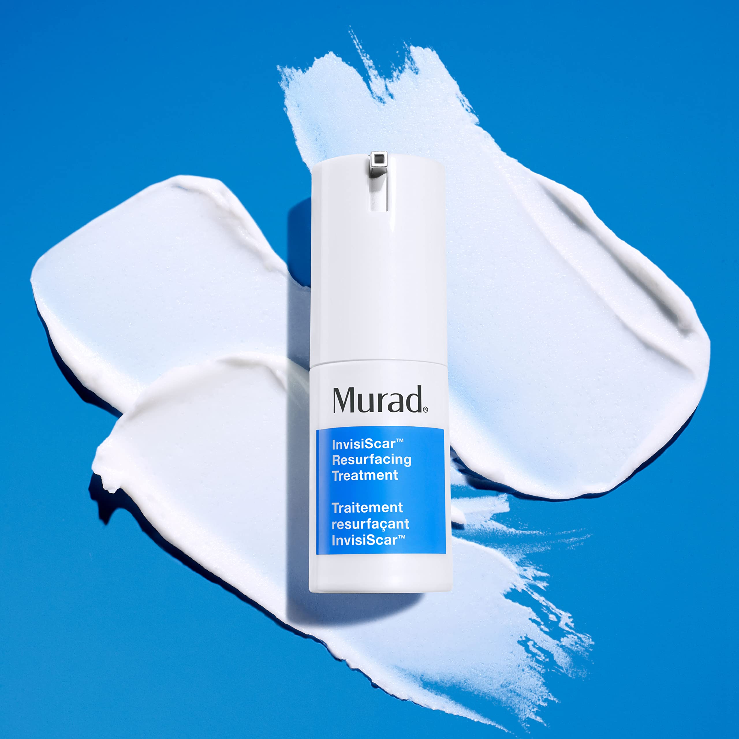 Applying Murad InvisiScar from the dispenser to target post-acne scarring.