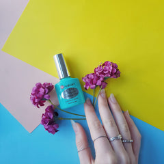 Nail-Aid Biotin Ultimate Strength base and top coat in use for color protection.