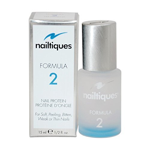 Botella de Nailtiques Formula 2 para fortalecimiento de uñas y secado rápido.