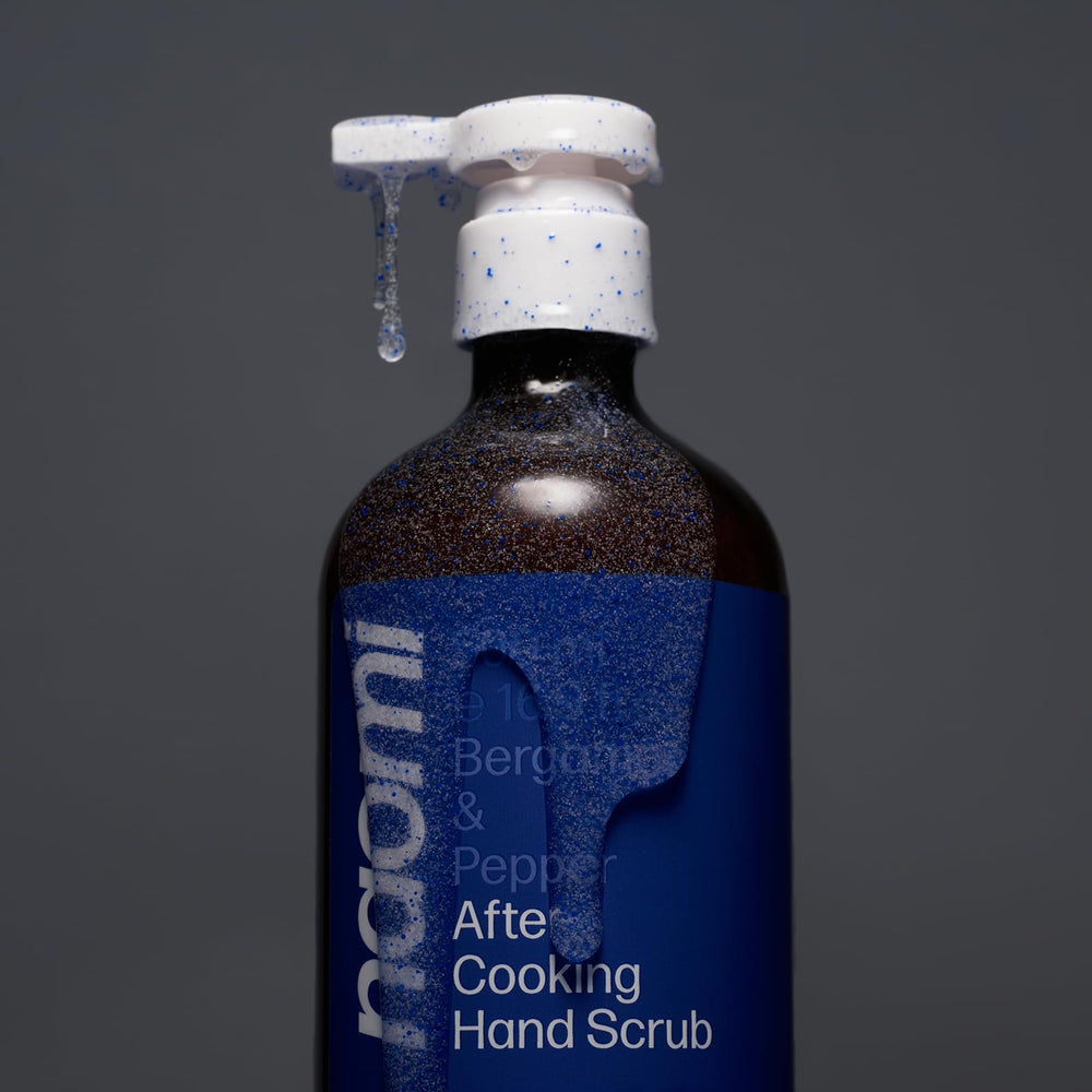 Naomi After-Cooking Hand Scrub close-up shows biodegradable jojoba beads for gentle exfoliation.