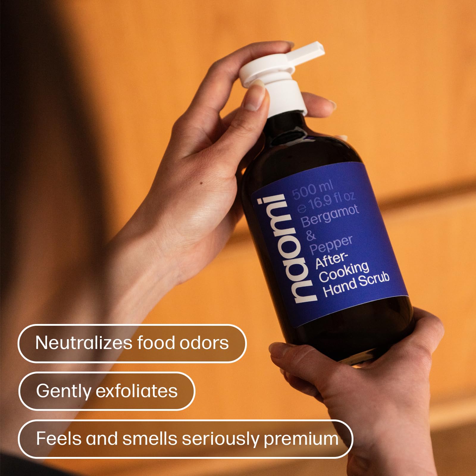 Naomi After-Cooking Hand Scrub jar showcases premium bergamot and pepper fragrance.
