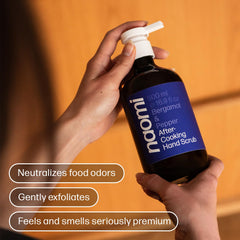 Naomi After-Cooking Hand Scrub jar showcases premium bergamot and pepper fragrance.