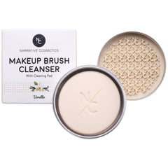 Narrative Cosmetics solid brush cleanser soap in hand for quick brush cleaning.