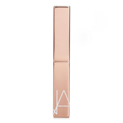 NARS Afterglow Sensual Shine Lipstick Dolce Vita on lips demonstrates lightweight, non-sticky shine.