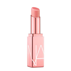 NARS Orgasm Afterglow Lip Balm tube delivering hydrating glow in universal shade