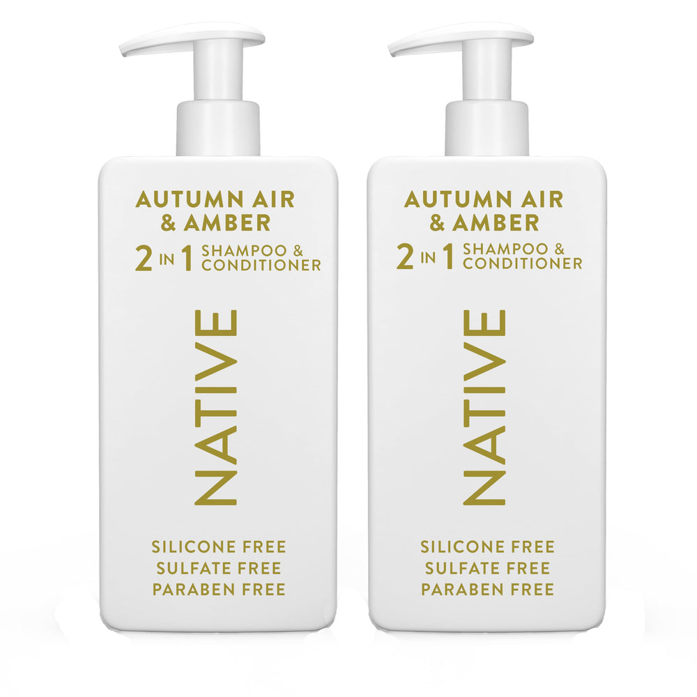 Native 2-in-1 shampoo and conditioner bottle with autumn air amber scent promotes refreshed hair.