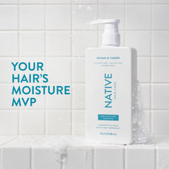 Native Ocean & Timber conditioner bottle highlights nourishing formula for detangling.
