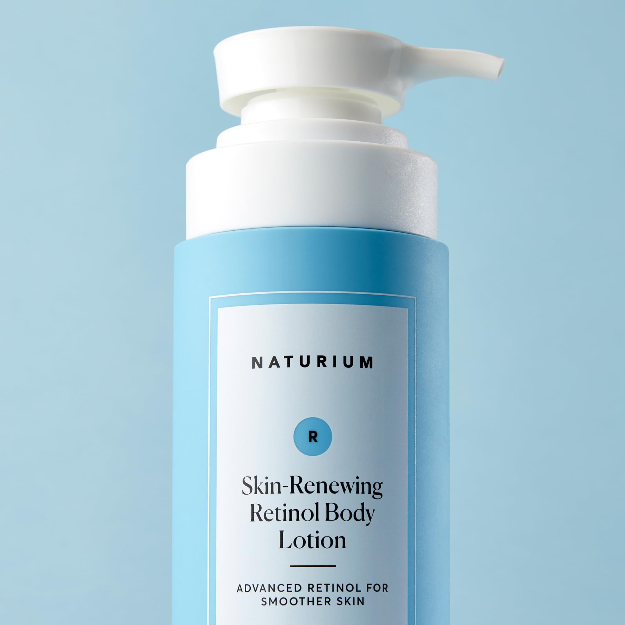 Naturium creamy lotion texture close-up with soft, supple skin after application.
